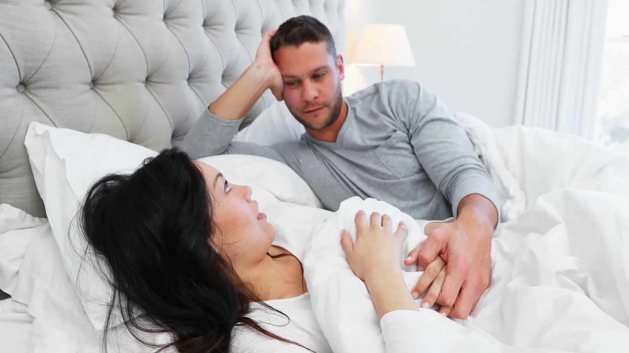 Romantic couple interacting with each other on bed 4k