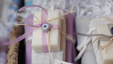 handmade soaps with evil eye charms and ribbons