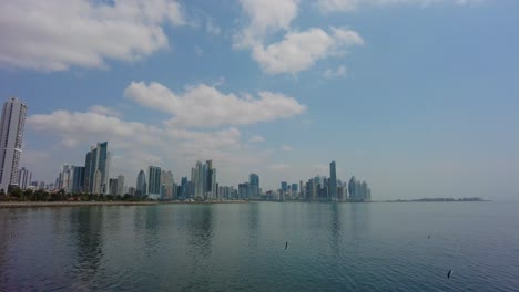 Panama-City-from-across-the-river,-the-city's-skyline-in-all-its-glory,-with-its-towering-skyscrapers