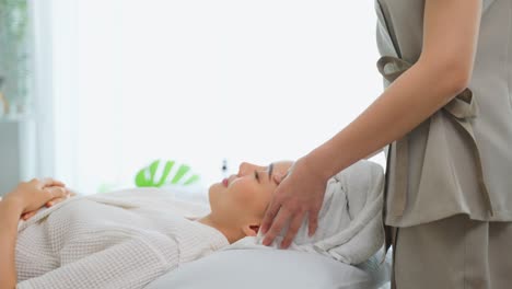 woman receiving a facial massage