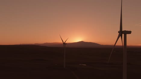 aerial shots of a wind farm near calhan in colorado around sunset