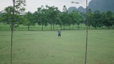 man walking in a rural landscape