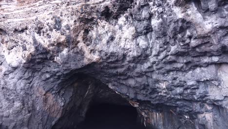 a shot sailing towards  a cave entrance