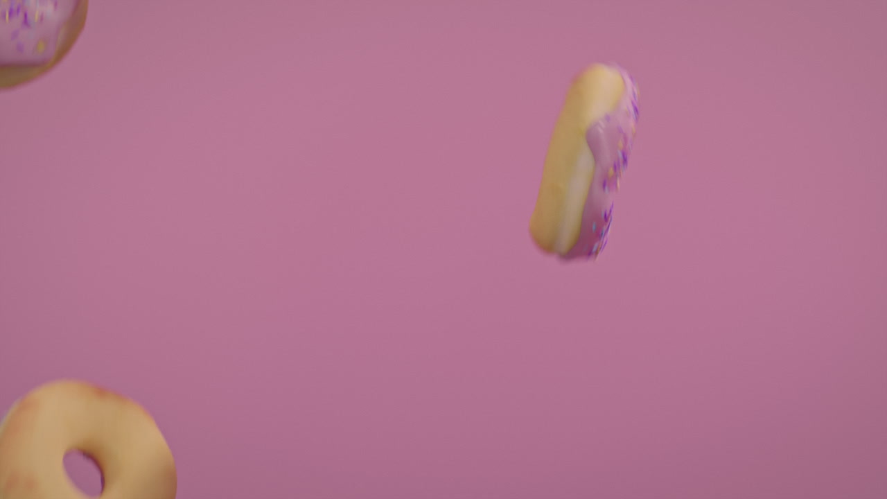 Pink glaze donuts on a pink background