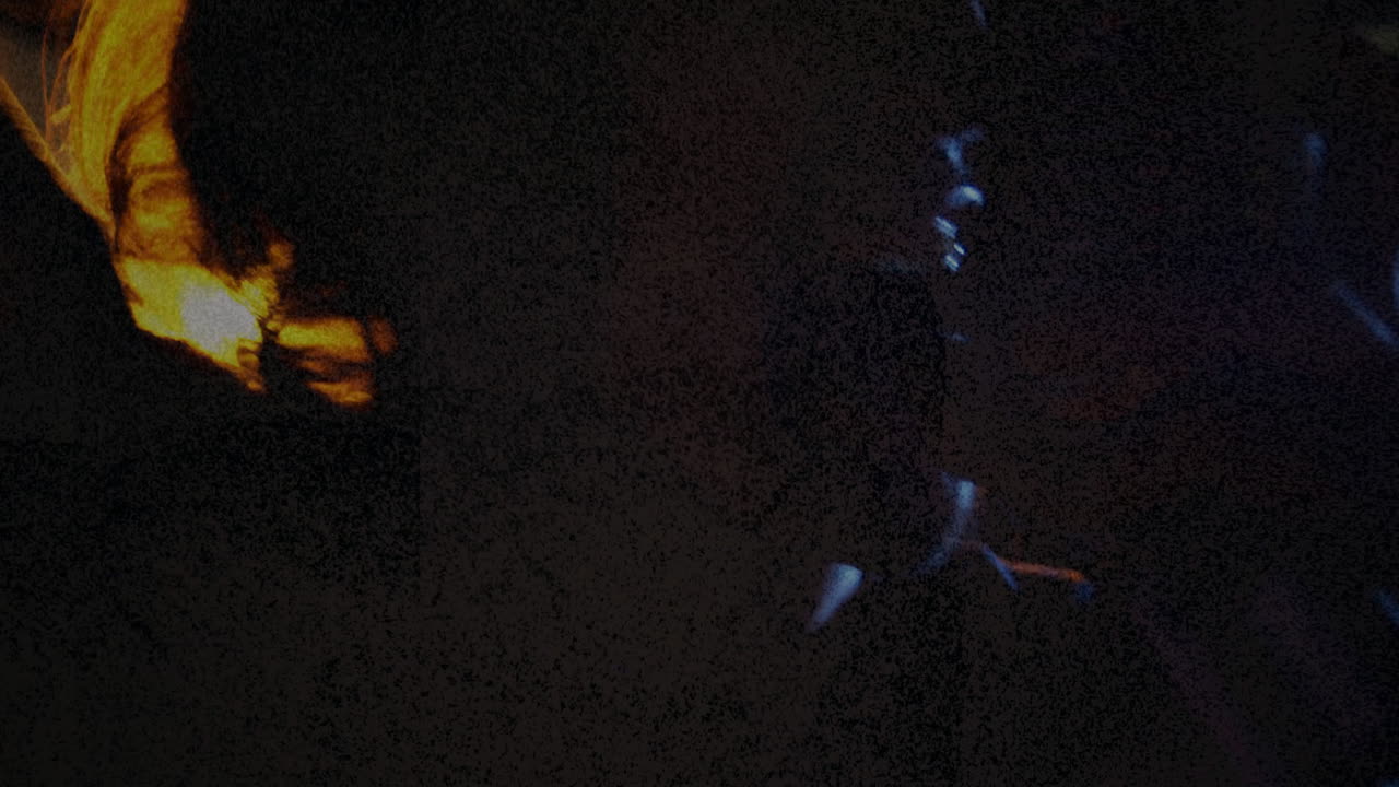 Male exploring moody interior, blending firelight and blue rim lighting for graphic design