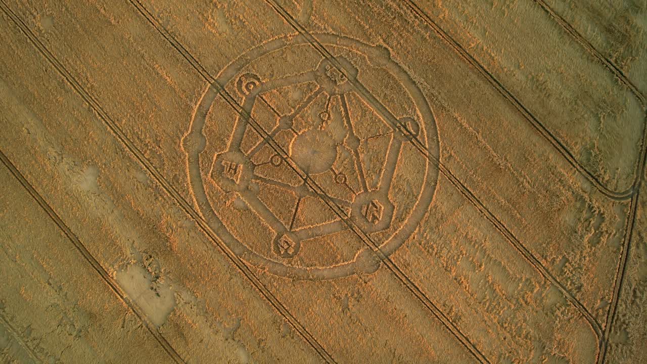 Fortnite game molecular crop circle pattern aerial view in Uffcot farmland wheat field tilting Birdseye