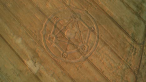 fortnite game molecular crop circle pattern aerial view in uffcot farmland wheat field tilting birdseye