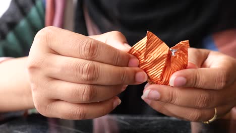 woman unwrapping chocolate