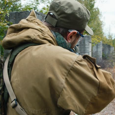 a man plays airsoft with a pistol in his hand 8