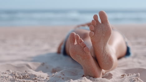 close up woman feet relaxing on beach tourist enjoying warm summer vacation on tropical seaside