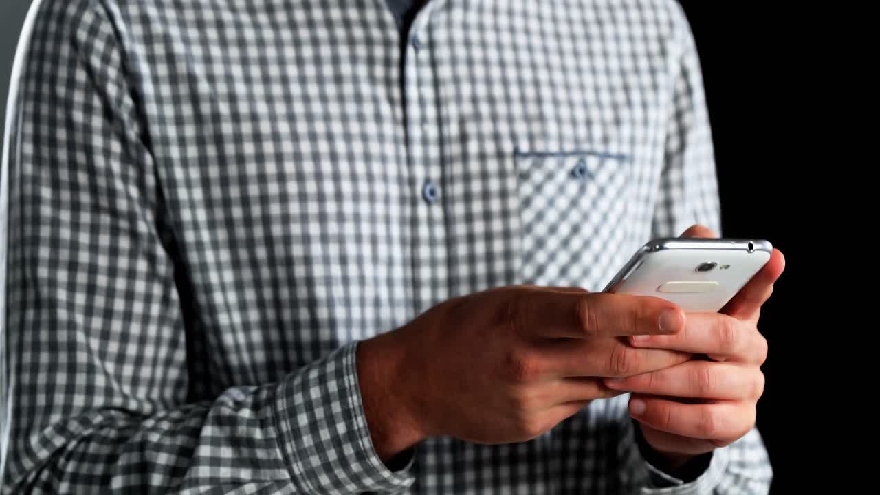 Mid section of man using mobile phone 4k