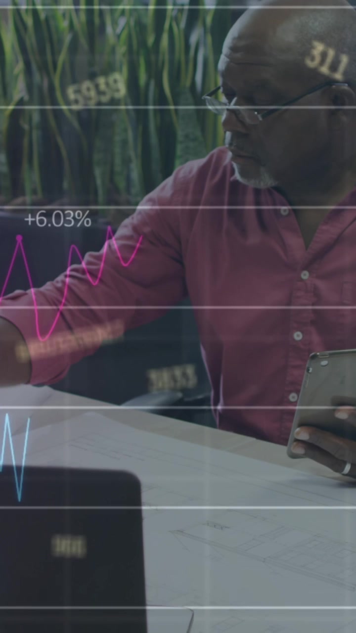 Animation of stock market data processing over african american man working on a plan at office
