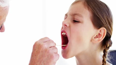 male doctor examining a patient