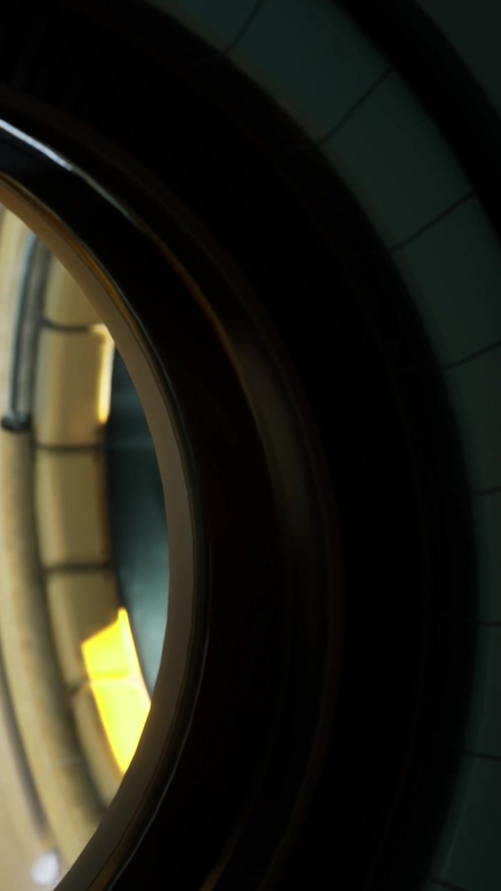View of round window showing interior space with light coming through