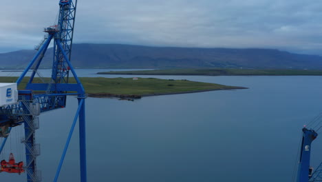 Birds-eye-view-of-Sundahofn-coastal-cargo-harbor-is-east-side-Reykjavik,-Iceland.-Aerial-view-of-elevators-and-containers-stocked-on-docks-of-the-port.-Industrial-and-commercial.-Import-and-export