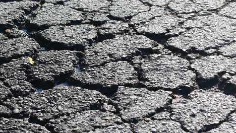 cracked asphalt road surface