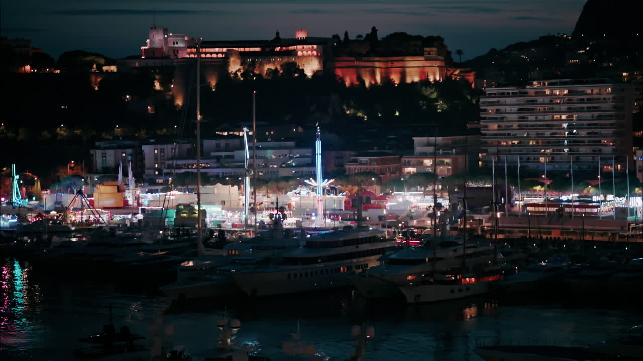 Aerial view of the Port Hercule Funfair in Monaco at night
