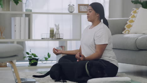 plus size woman meditating in her home living