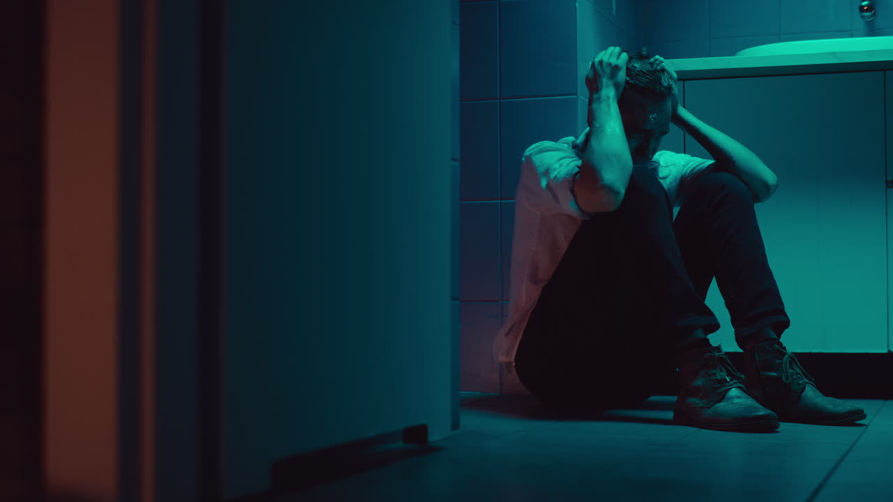 Man in Distress in Bathroom