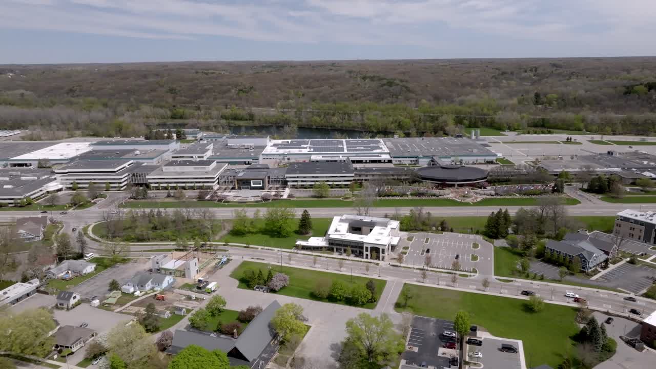 Amway North American Headquarters building in Ada, Michigan with drone video moving left to right.