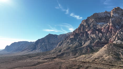 aerial view of mountainside and blue skies near red rock canyon in las vegas nevada