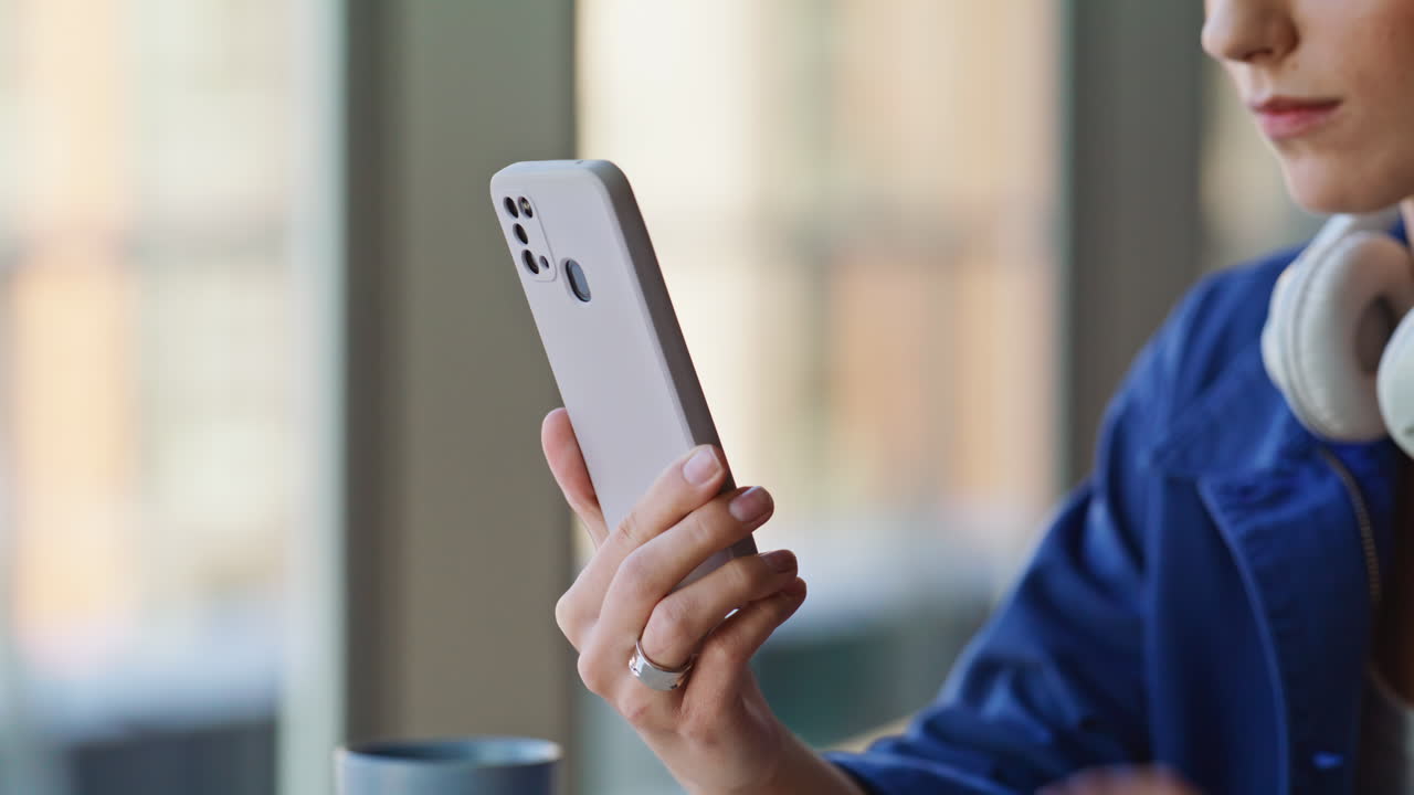 Successful manager browsing banking app cellphone in office coworking closeup