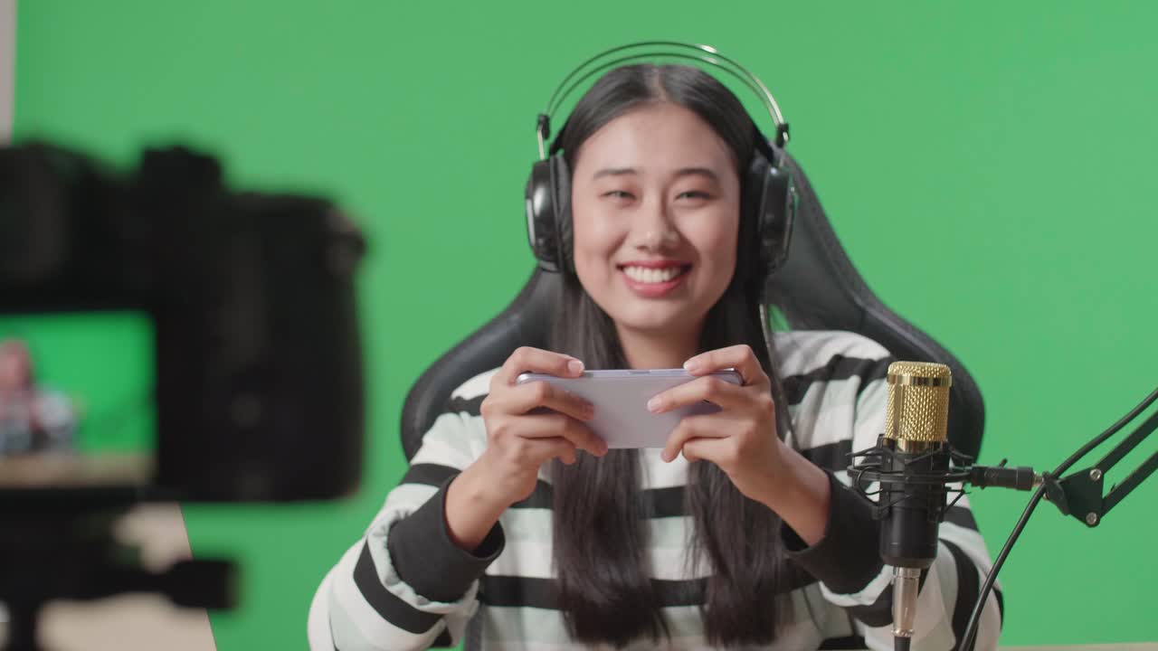 Woman Streaming Mobile Game on Green Screen