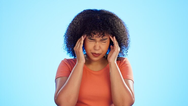 Headache, pain and face of woman on blue