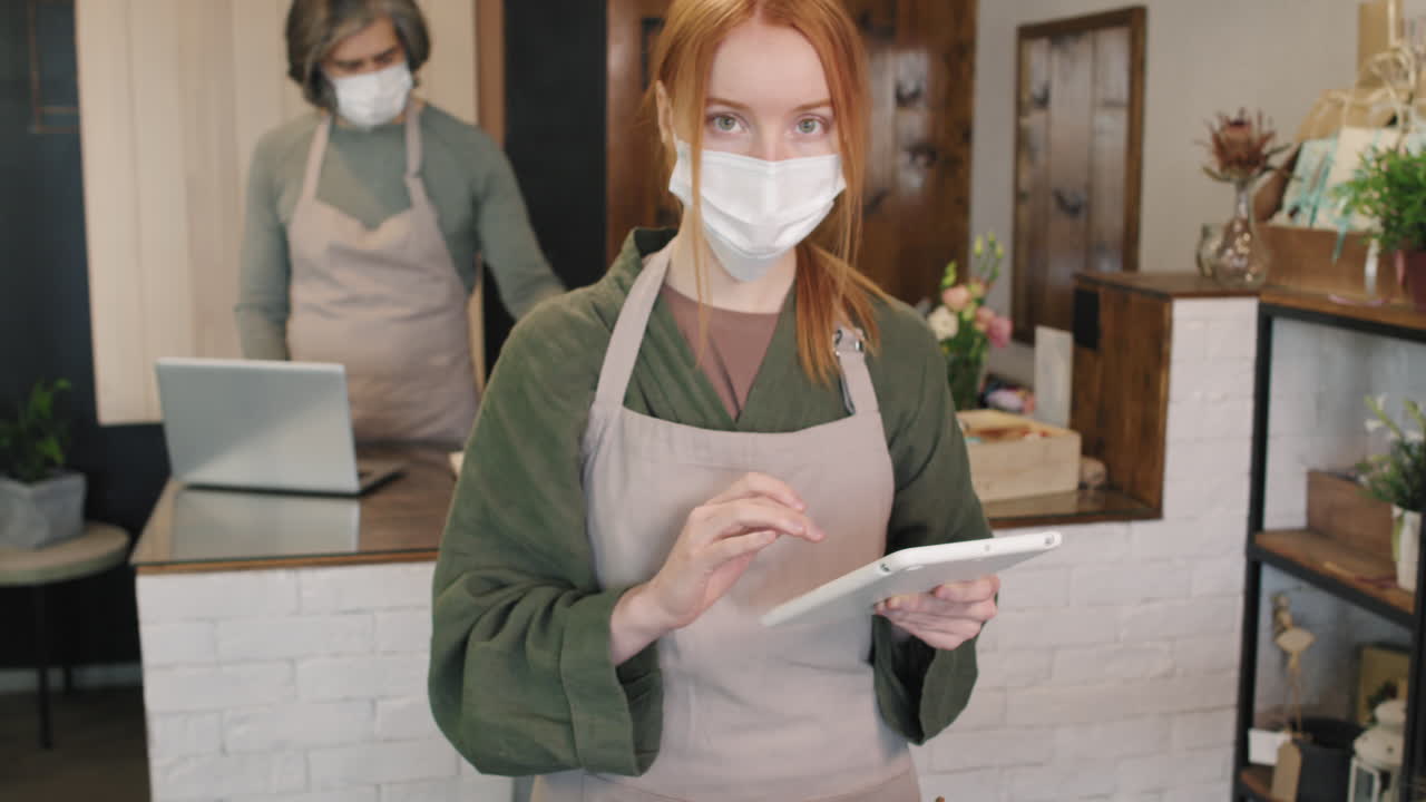 Portrait Of Pretty Florist In Mask