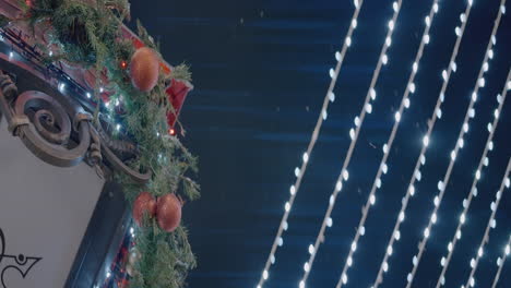 christmas decorated streetlamp at night