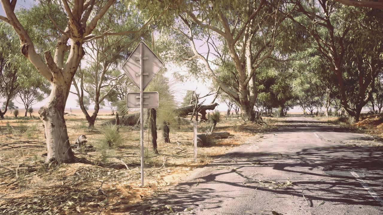Scenic rural road with trees and sign under clear sky in daytime