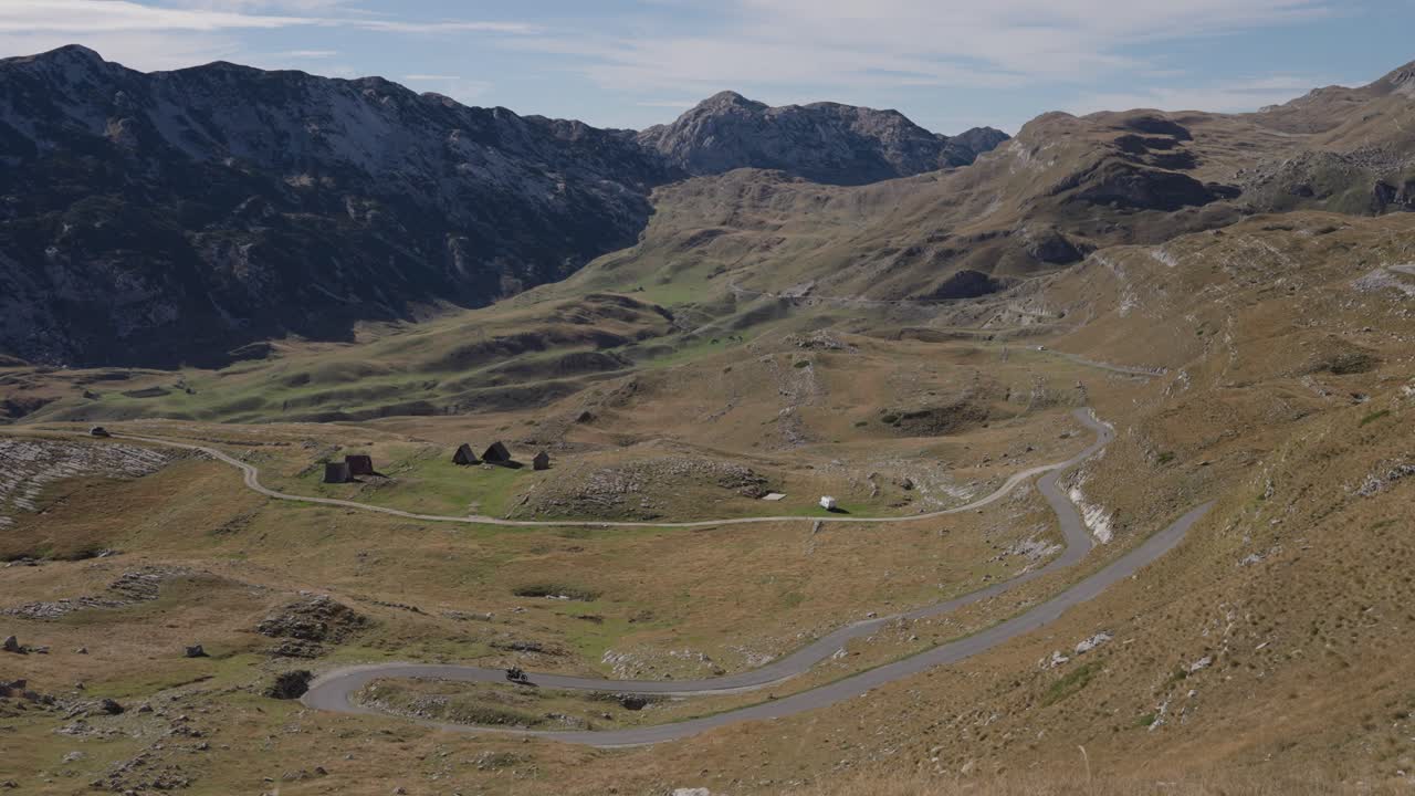 Panorama view mountain pass road, Durmitor in Montenegro, countryside landscape with motorcycle