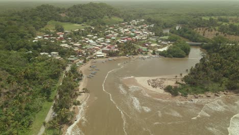 aerial drone view of the atlantic ocean meet the ortoire river on the south eastern coast of trinidad