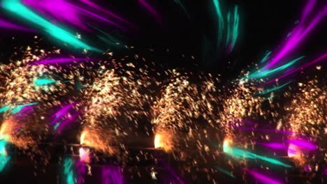 animation of fireworks over glowing light trails in background