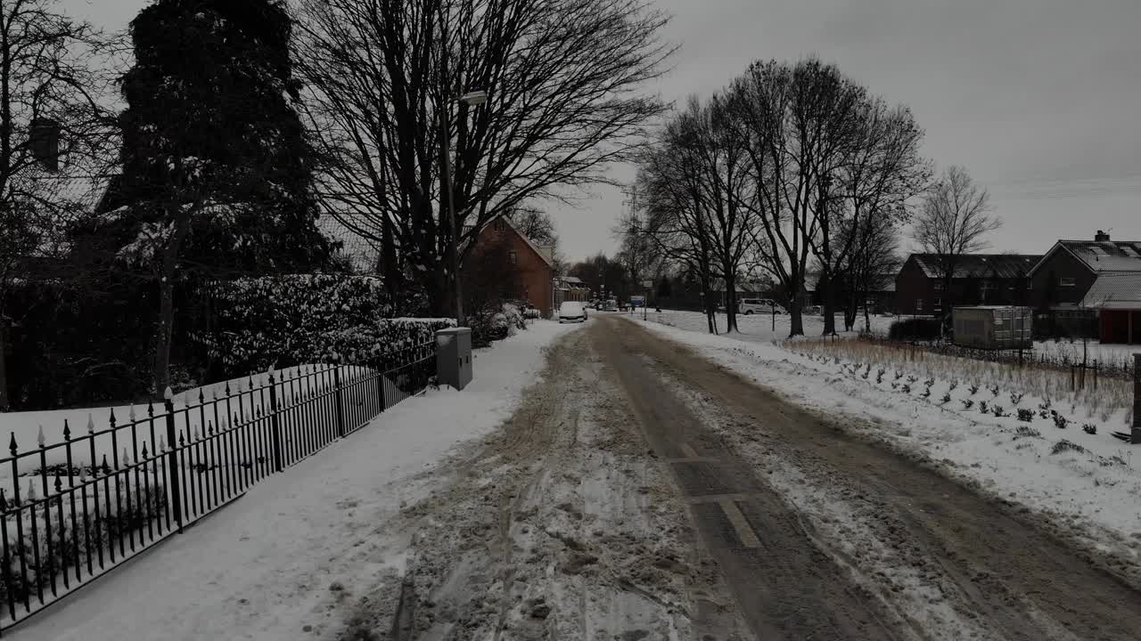 Empty Road With Snow On A Winter Day.  - aerial