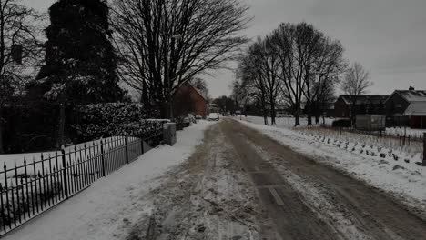 empty road with snow on a winter day.  - aerial
