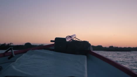 slow motion boat at sea with sunset