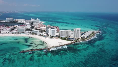 cancun coastline with resorts and turquoise sea, aerial view