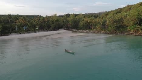 aerial view of a tropical beach with a boat