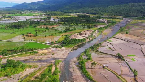 Panoramic-View-Of-A-Countryside-Farmland-With-Working-Machineries-On-Quarry-Site-In-Southern-Leyte,-Philippines