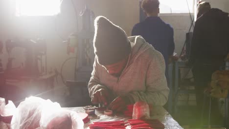 Mixed-race-man-working-in-factory