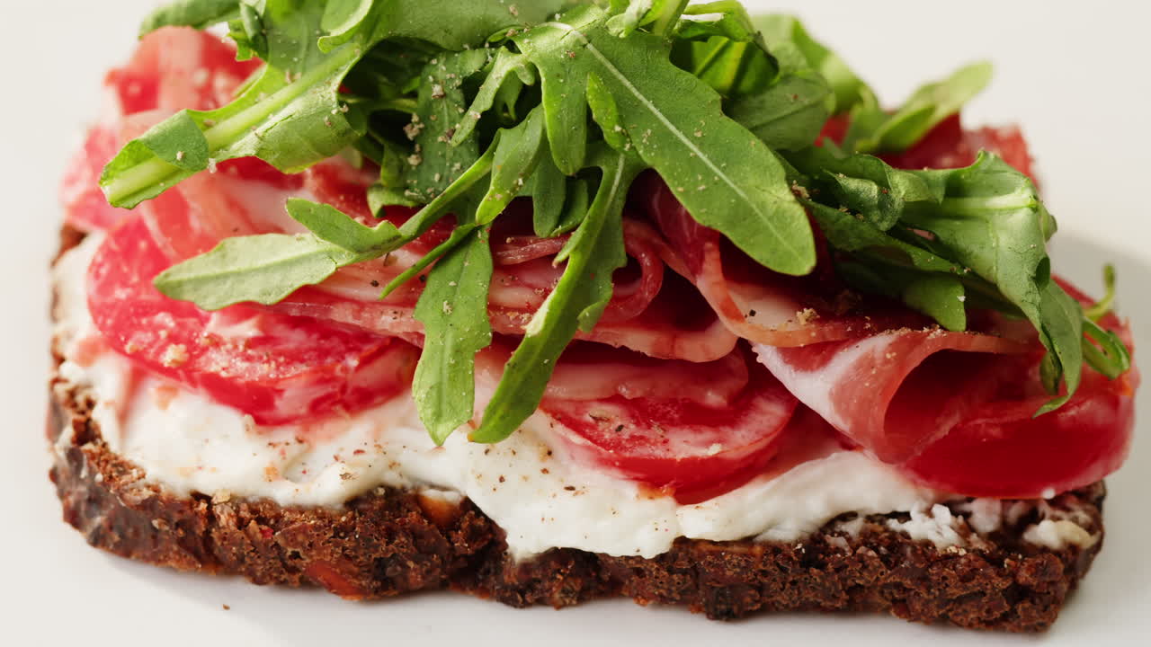 Delicious Open-Faced Sandwich with Prosciutto, Tomatoes and Arugula
