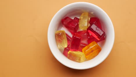 colorful hard candies in a white bowl