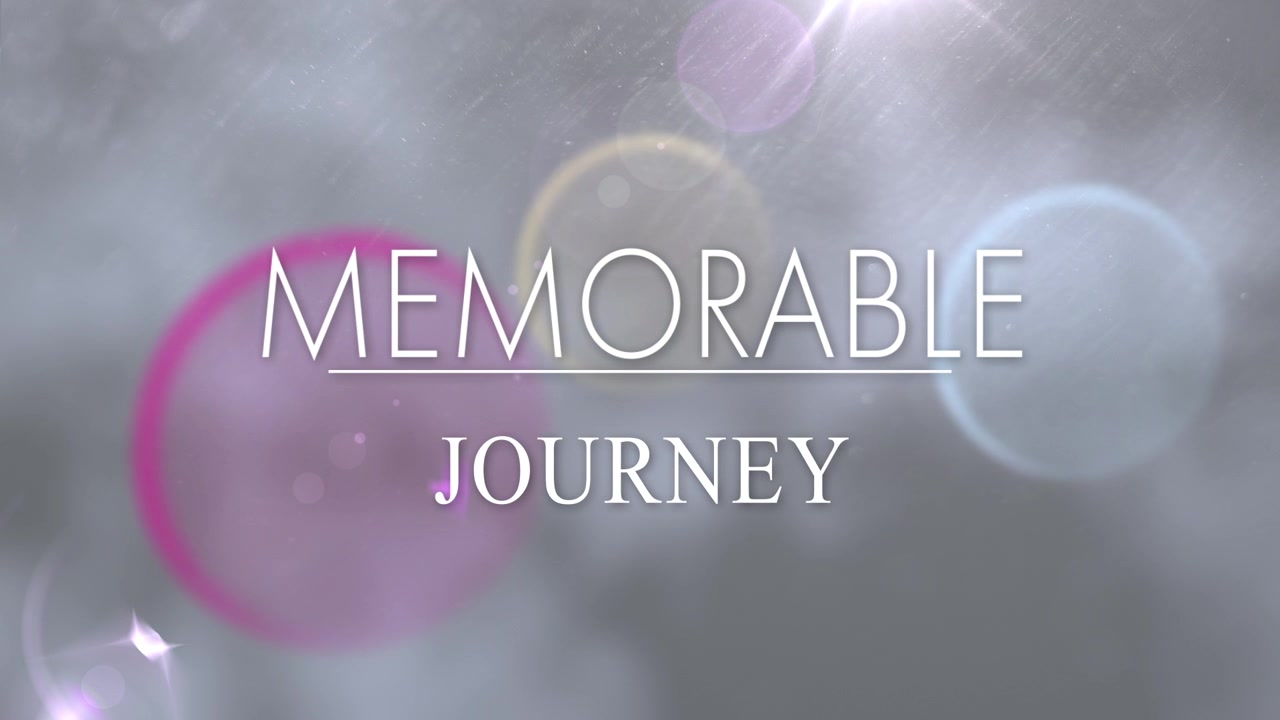 Appearing letters animating to complete MEMORABLE JOURNEY title over misty backdrop, with flares