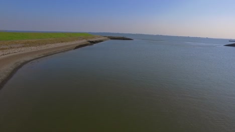 Manmade-bay-harbour-surrounded-by-dykes-in-Kruingen,-the-Netherlands