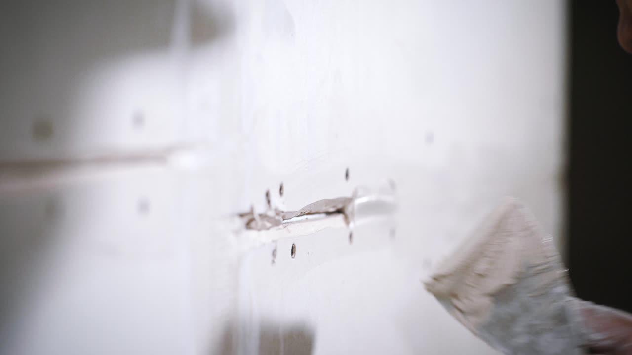 Repairing a Wall with Putty Knife