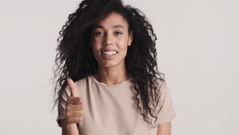 african american positive woman over white background.