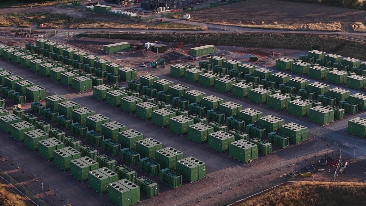 Aerial view of battery energy storage infrastructure storing renewable electricity for grid balancing, congestion reduction, backup power and smarter energy management.
