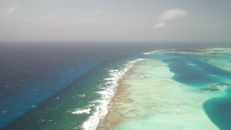 the vibrant barrier reef along sebastopol in los roques, showcasing turquoise waters, aerial view