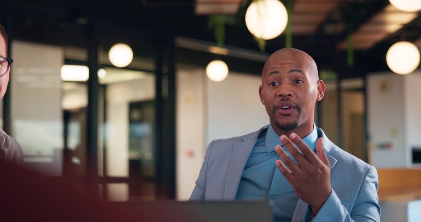 Professional Businessman Discussing Ideas in Modern Office Meeting